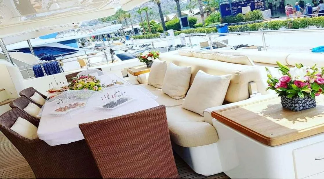 a room with chairs and tables aboard PAREAKKI Yacht for Sale
