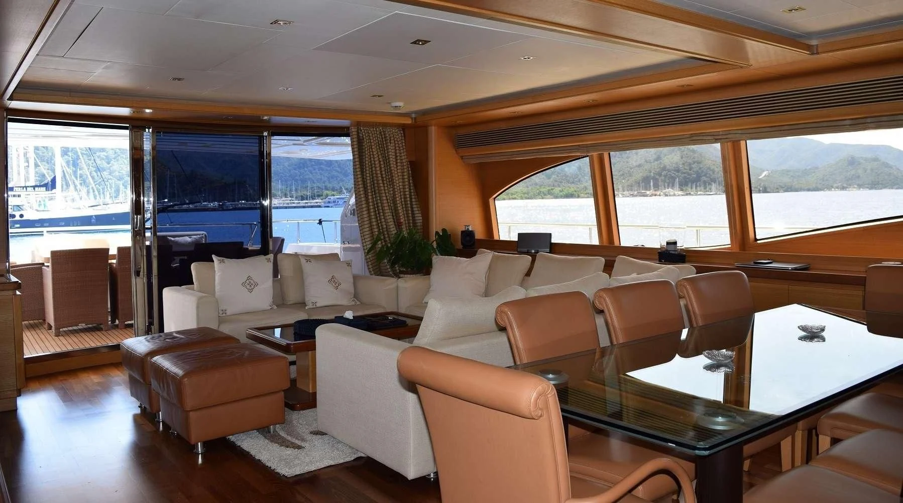 a living room with a large window aboard PAREAKKI Yacht for Sale