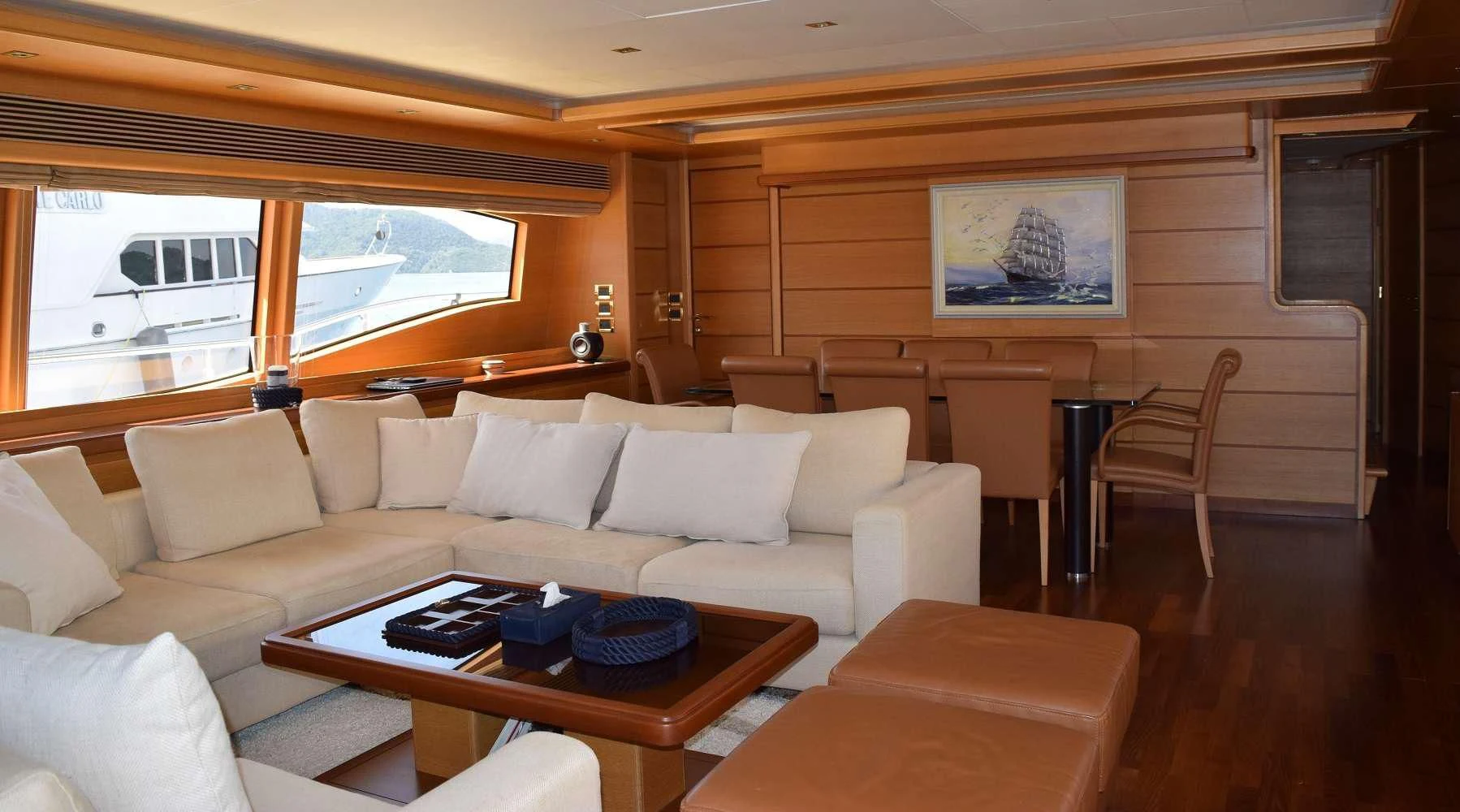 a living room with a couch and a table aboard PAREAKKI Yacht for Sale