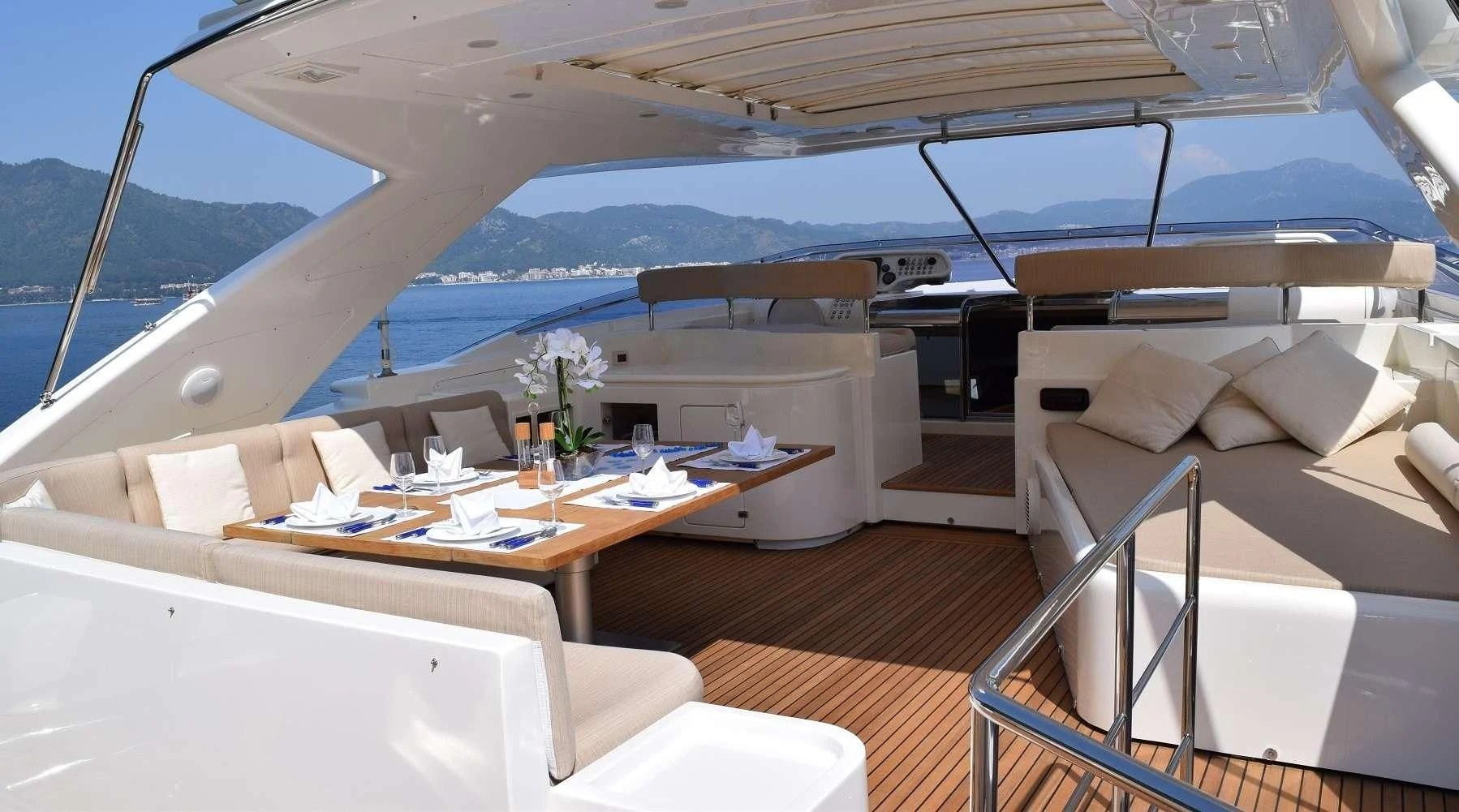 a room with a table and chairs aboard PAREAKKI Yacht for Sale
