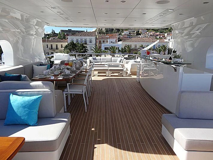 a room with a large table and chairs aboard I SEA Yacht for Sale