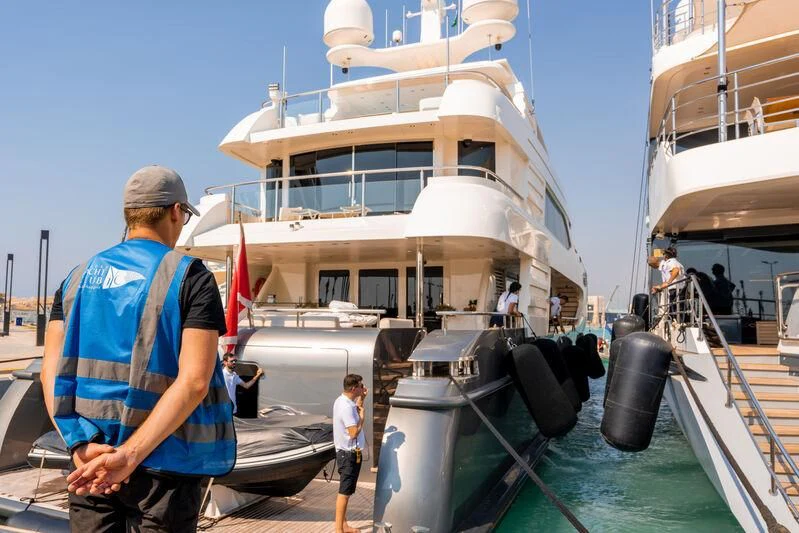a man standing next to a boat aboard I SEA Yacht for Sale