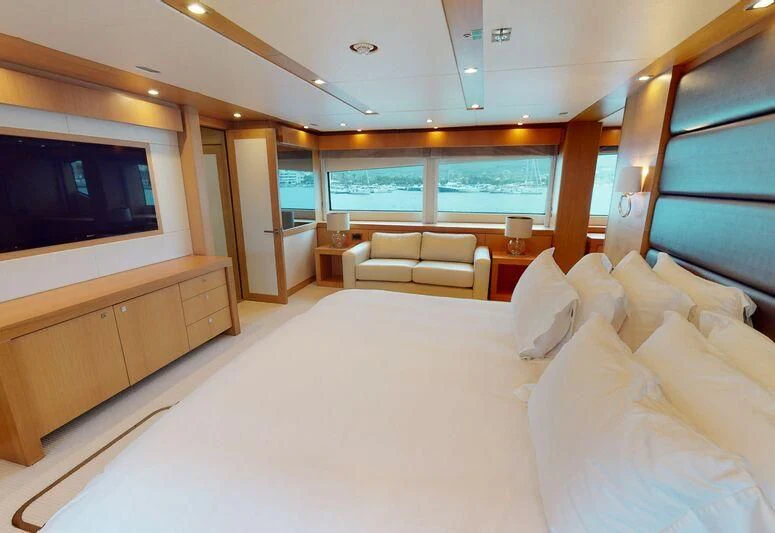 a room with a couch and a tv aboard MAKANI II Yacht for Charter