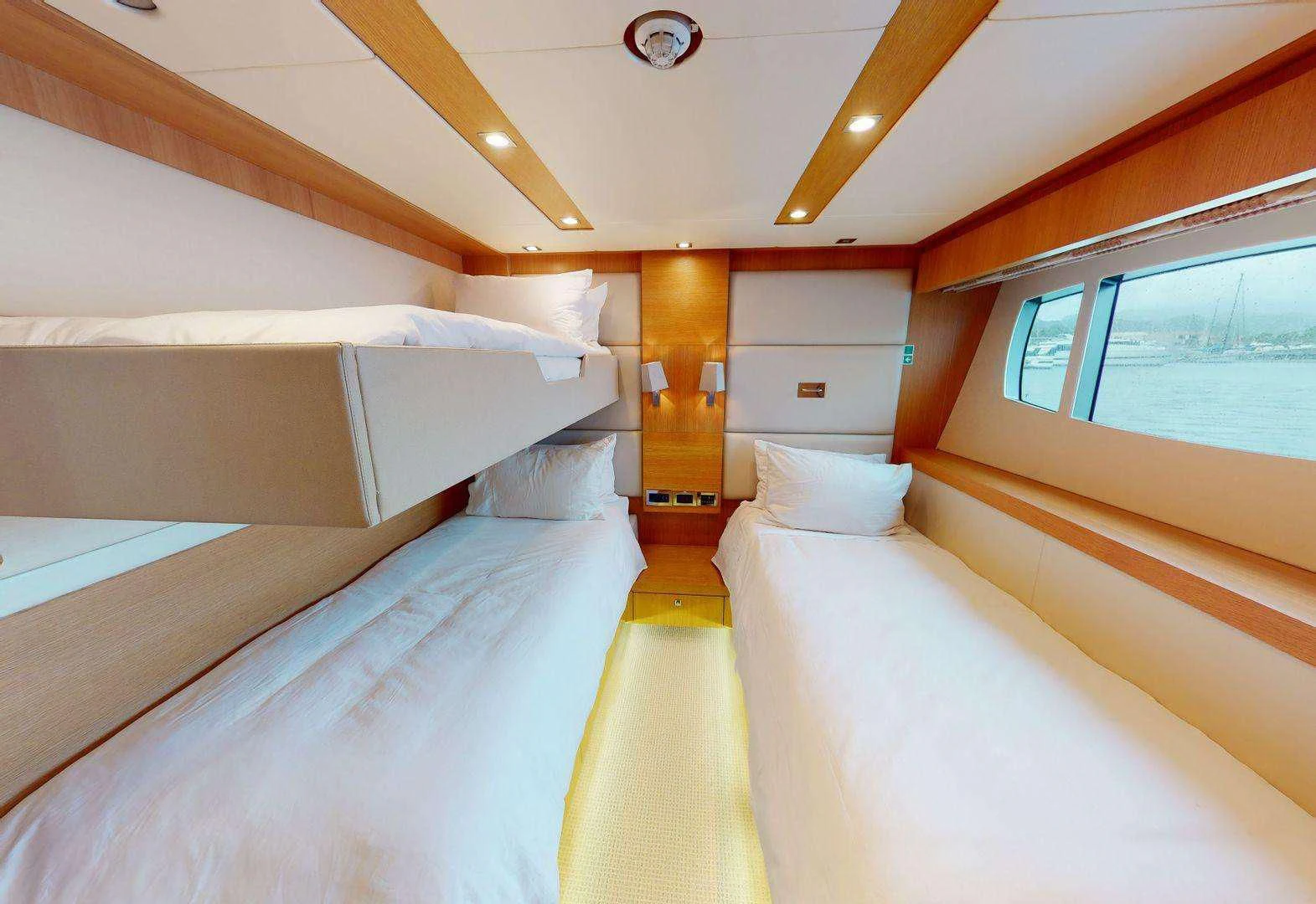 a room with a bed and a window aboard MAKANI II Yacht for Charter