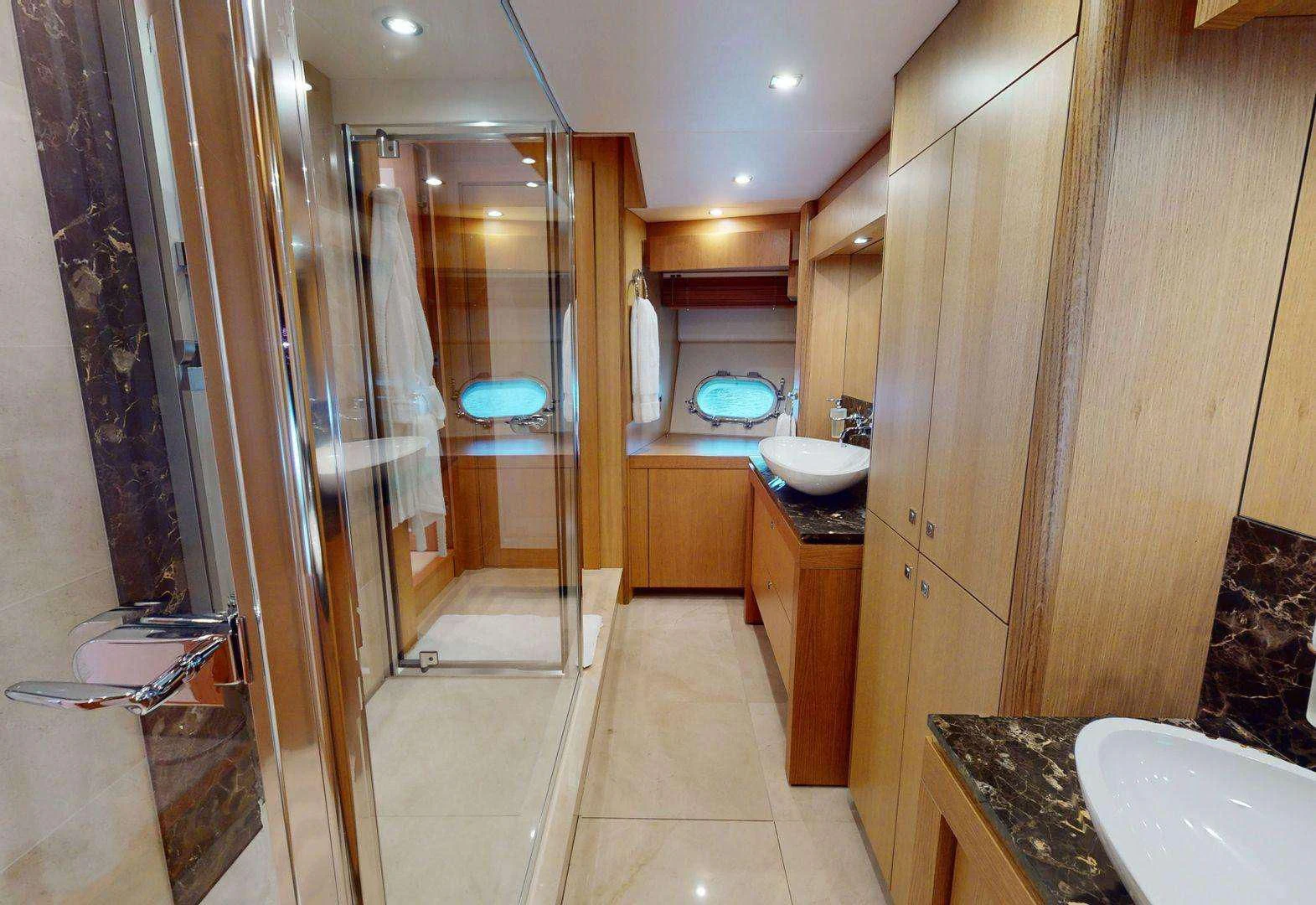 a bathroom with a shower and sink aboard MAKANI II Yacht for Charter