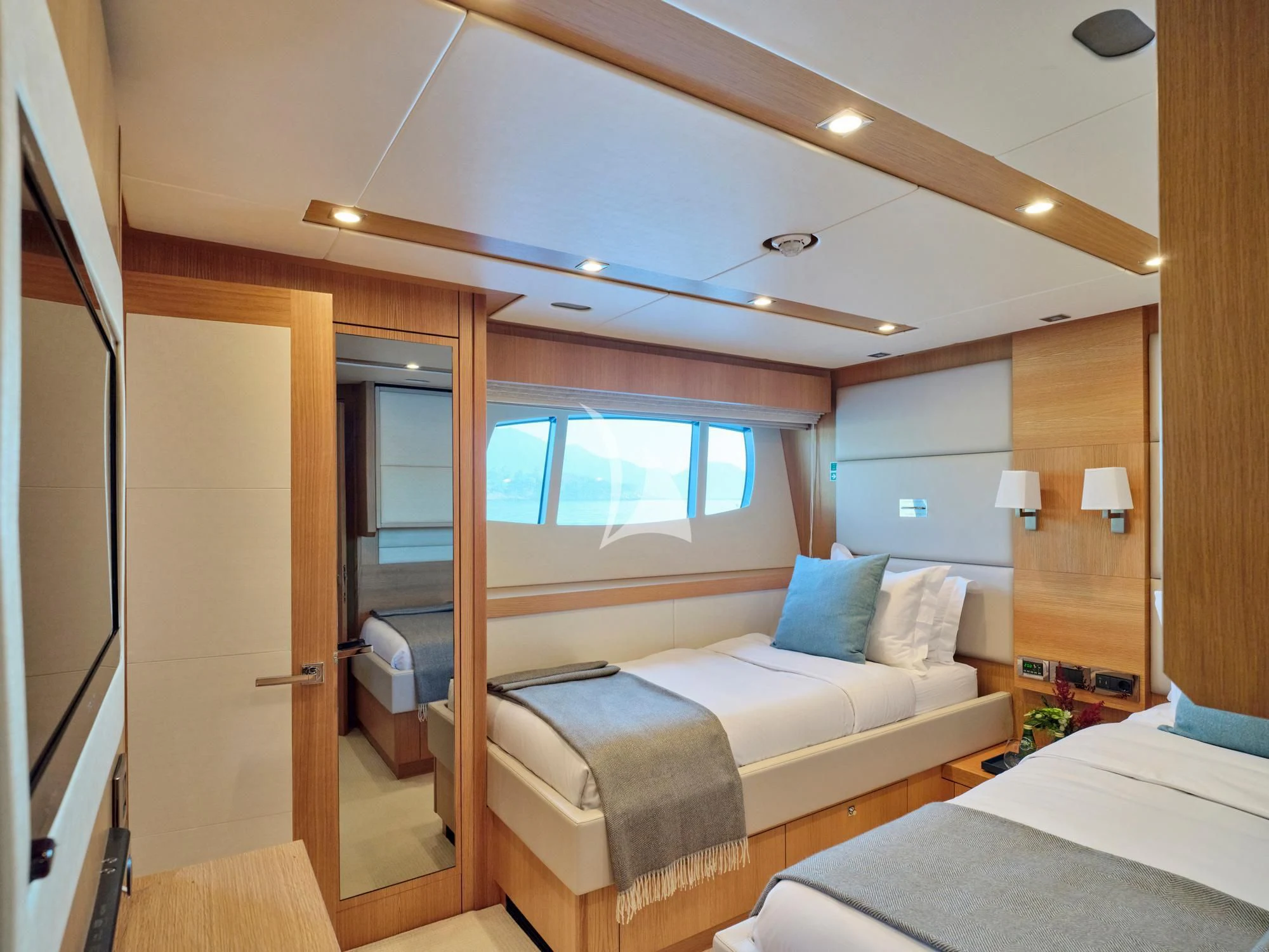 a room with a bed and a window aboard MAKANI II Yacht for Charter