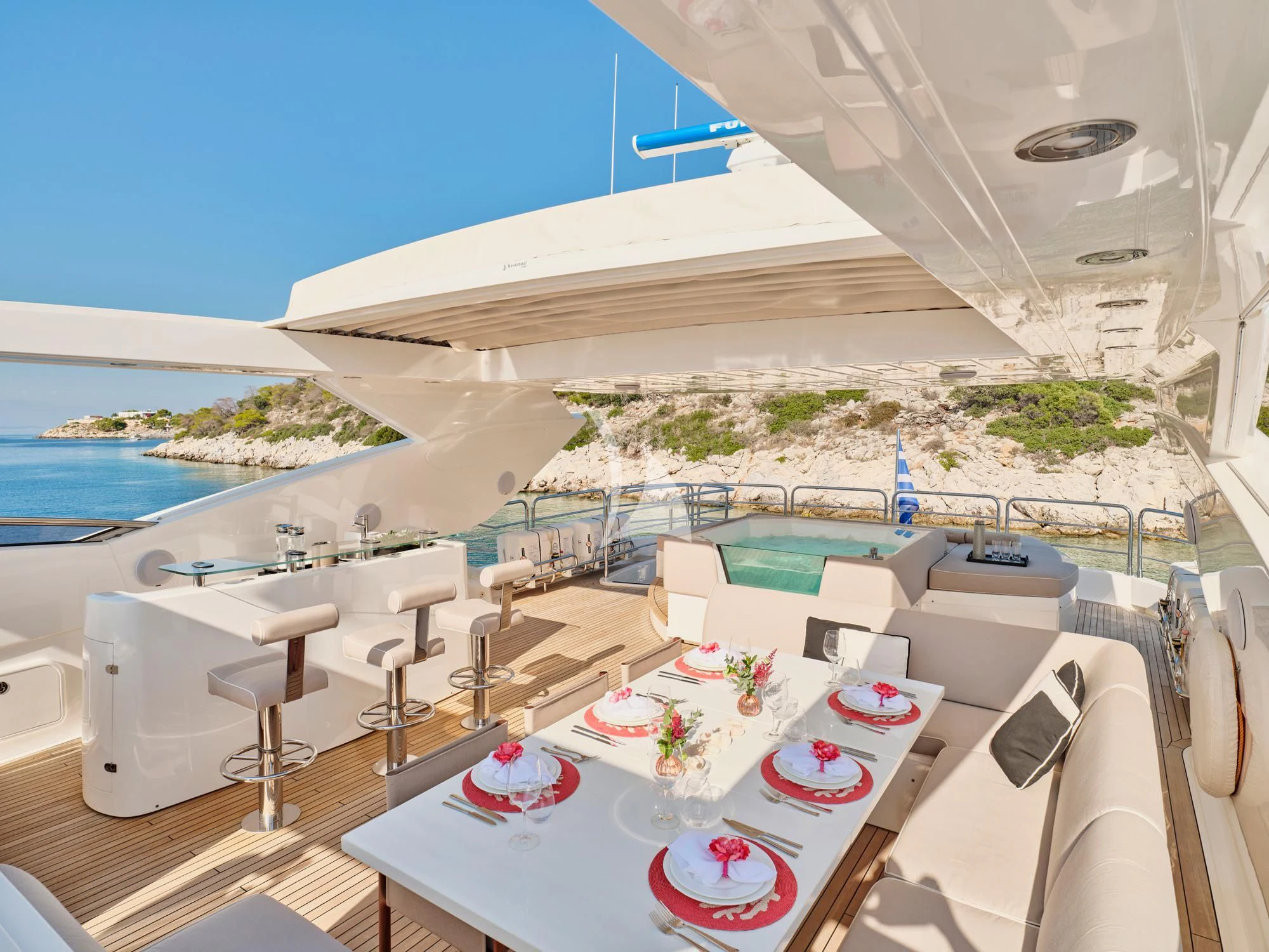 a room with a table and chairs aboard MAKANI II Yacht for Charter