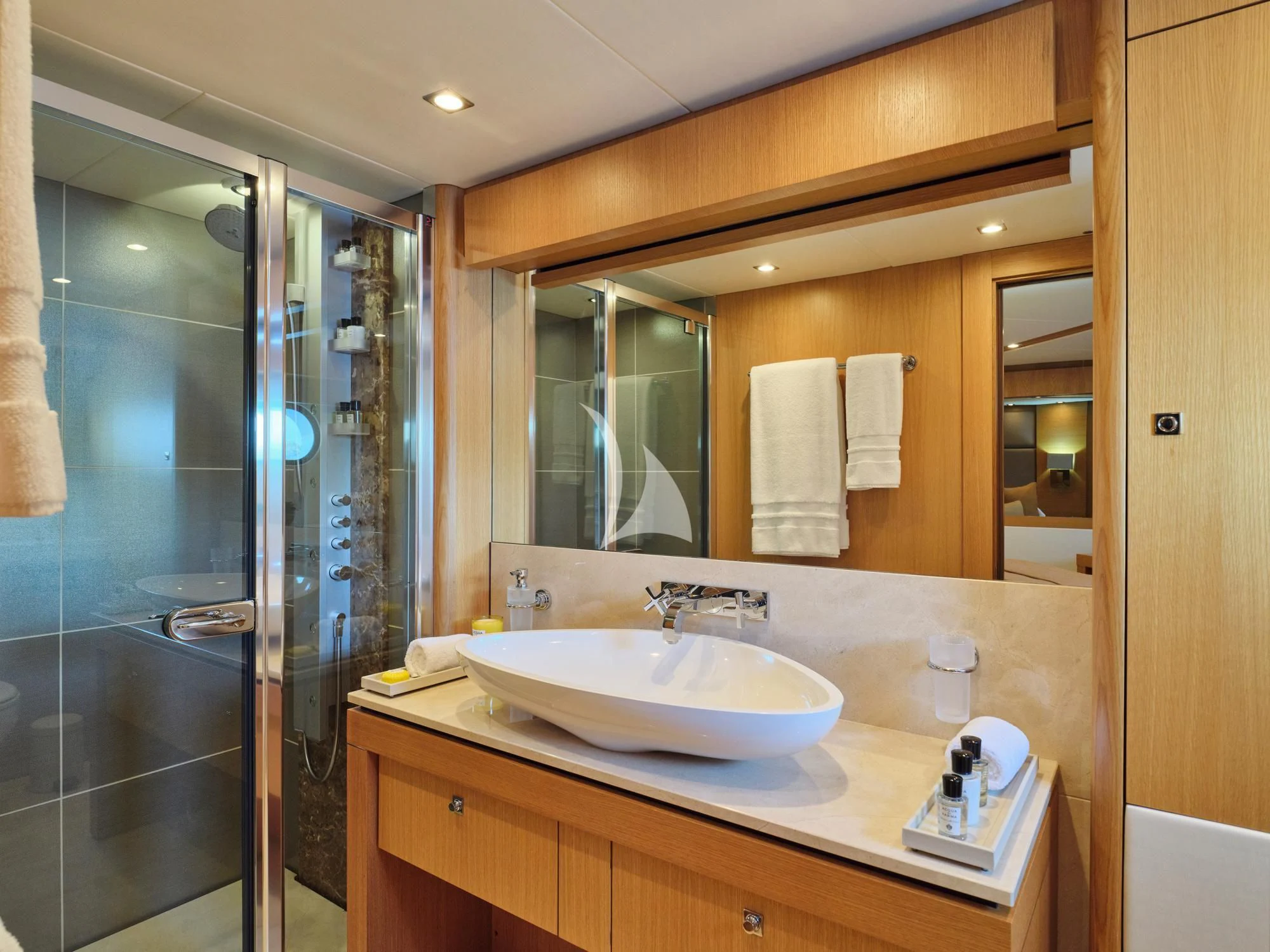 a bathroom with a large mirror aboard MAKANI II Yacht for Charter