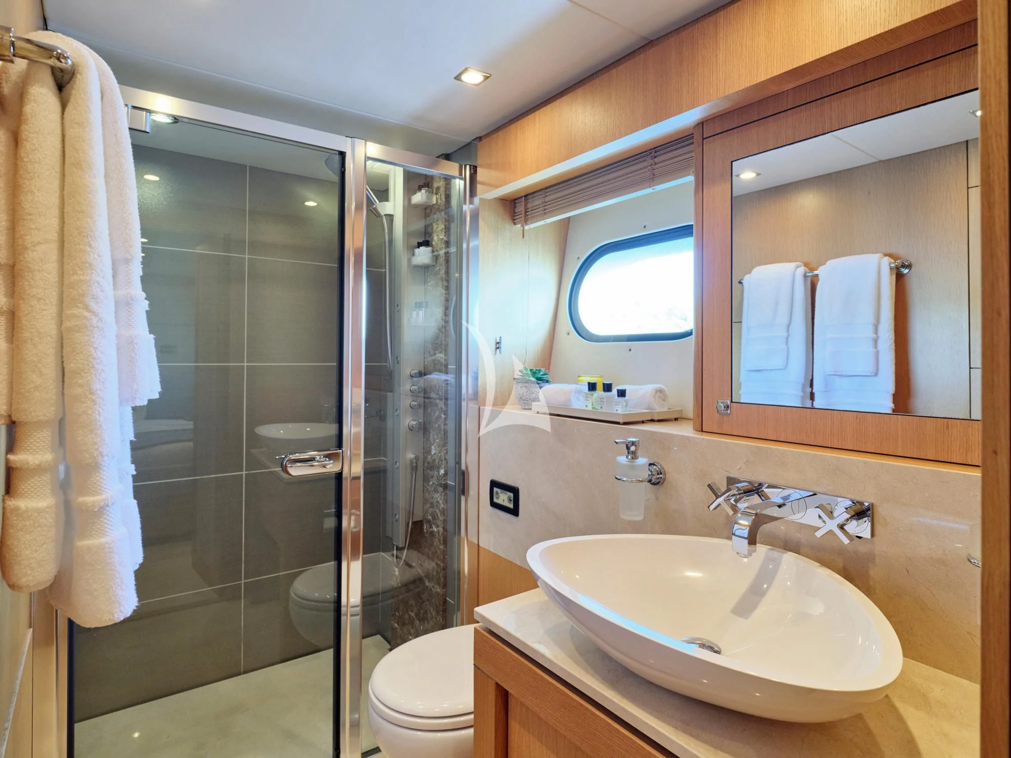 a bathroom with a glass shower aboard MAKANI II Yacht for Charter