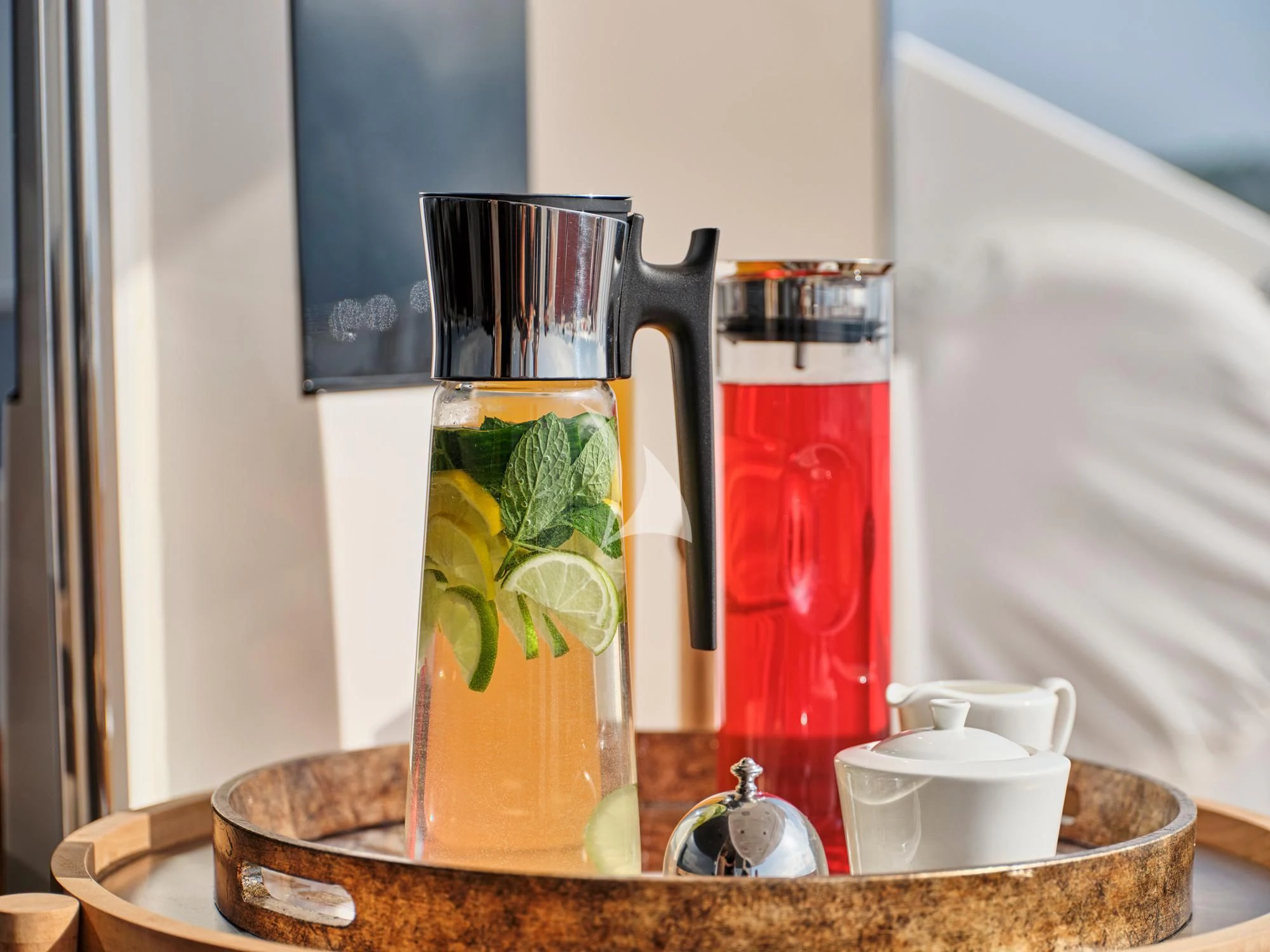 a glass jar with a liquid and a plant in it aboard MAKANI II Yacht for Charter