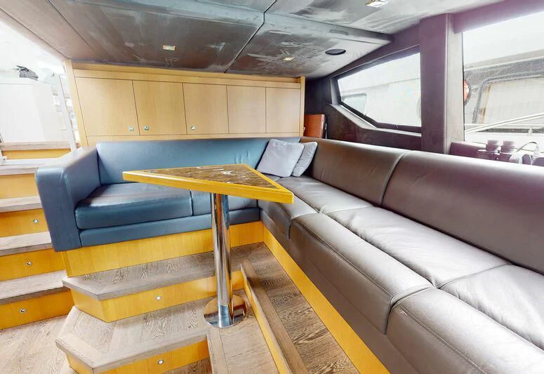 a room with a couch and a table aboard MAKANI II Yacht for Charter