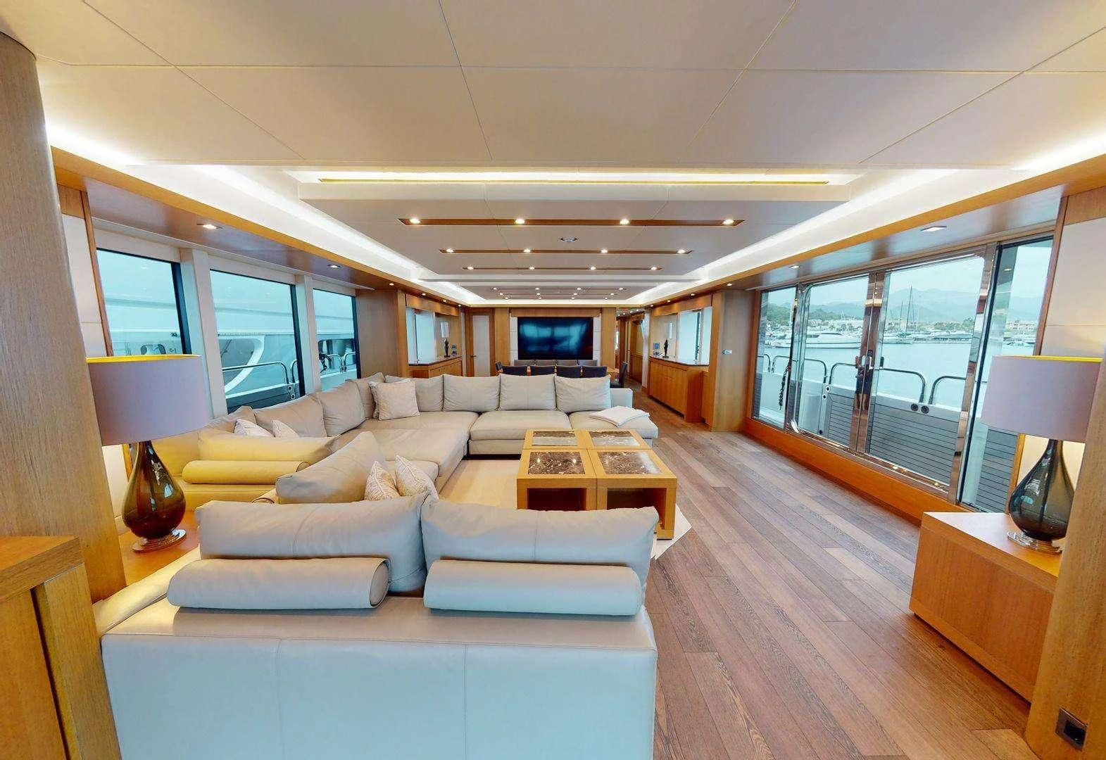 a living room with a large window aboard MAKANI II Yacht for Charter