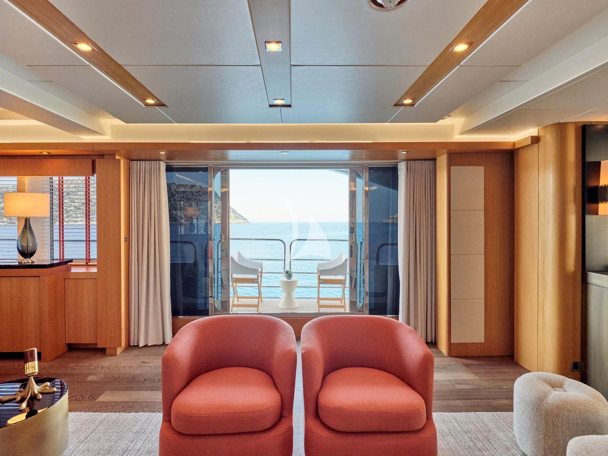 a living room with a large window aboard MAKANI II Yacht for Charter