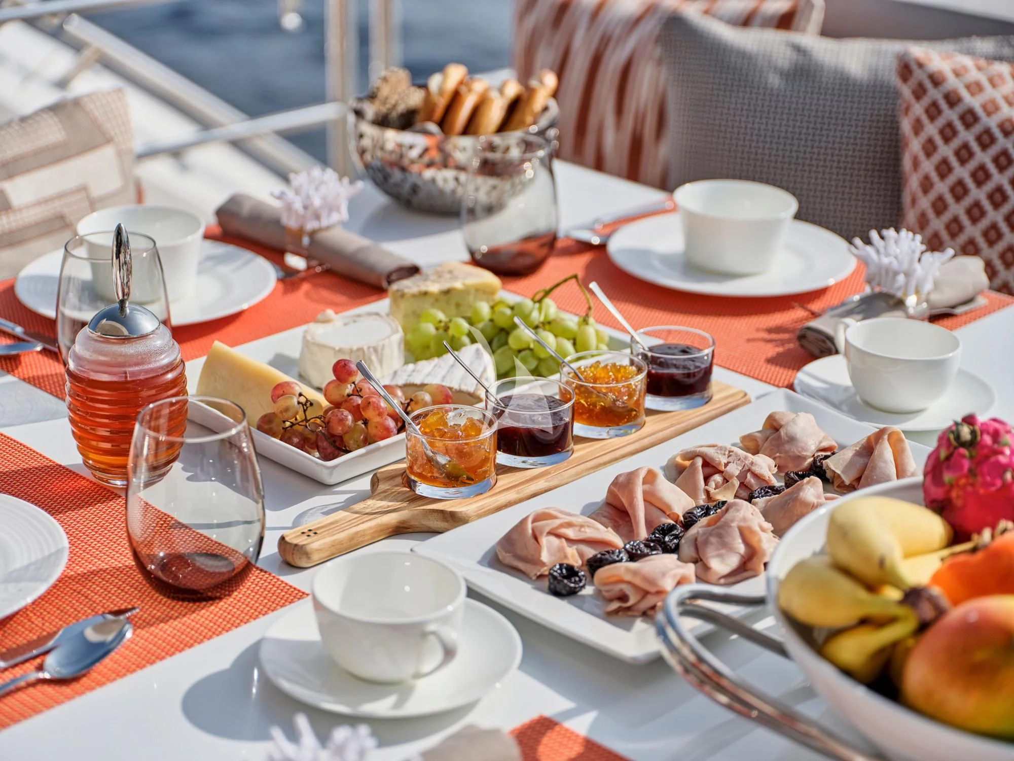 a table with food and drinks aboard MAKANI II Yacht for Charter