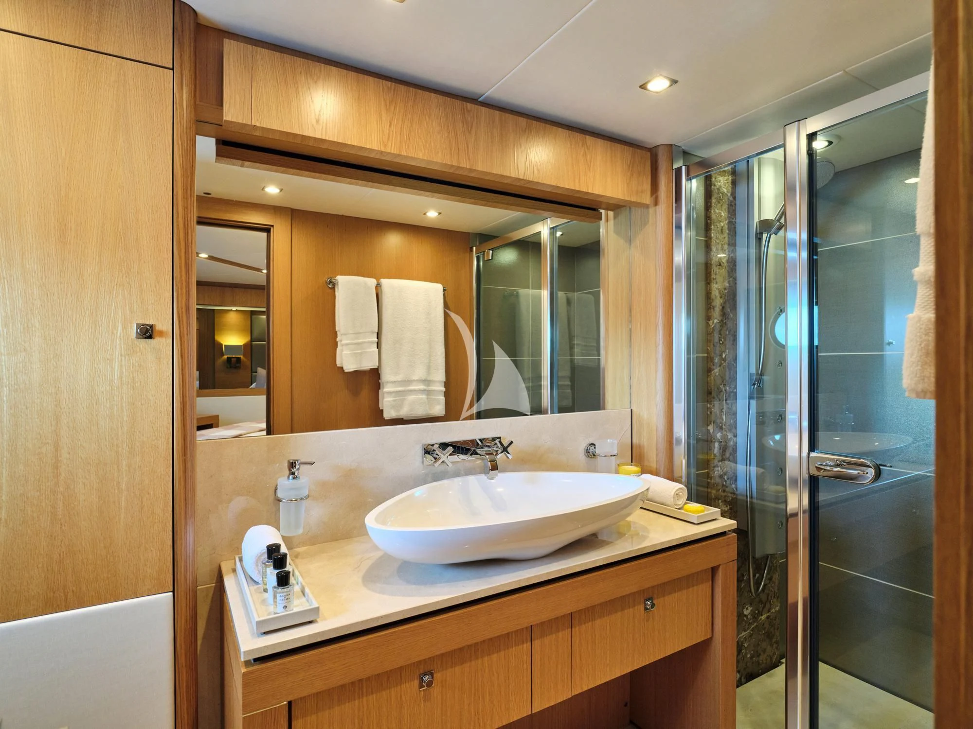 a bathroom with a sink and a mirror aboard MAKANI II Yacht for Charter