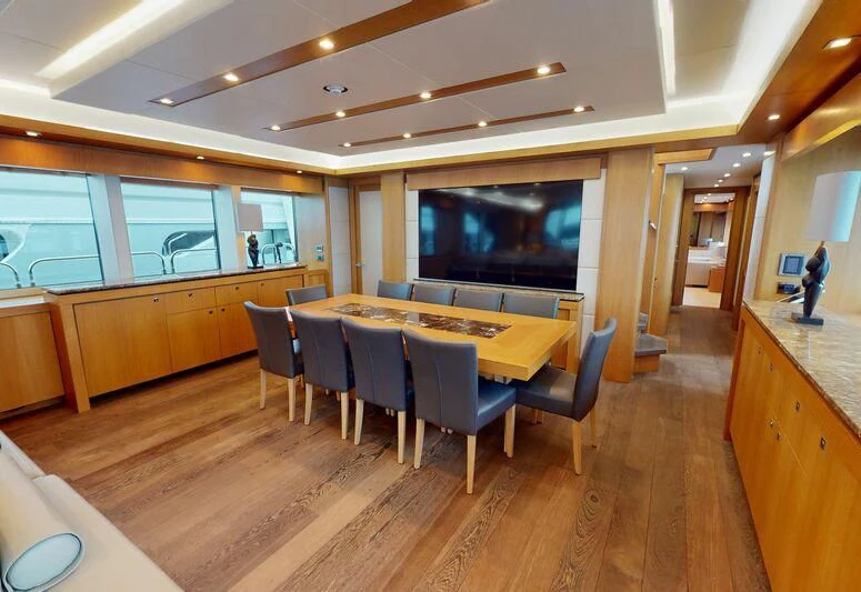 a large kitchen with a table and chairs aboard MAKANI II Yacht for Charter