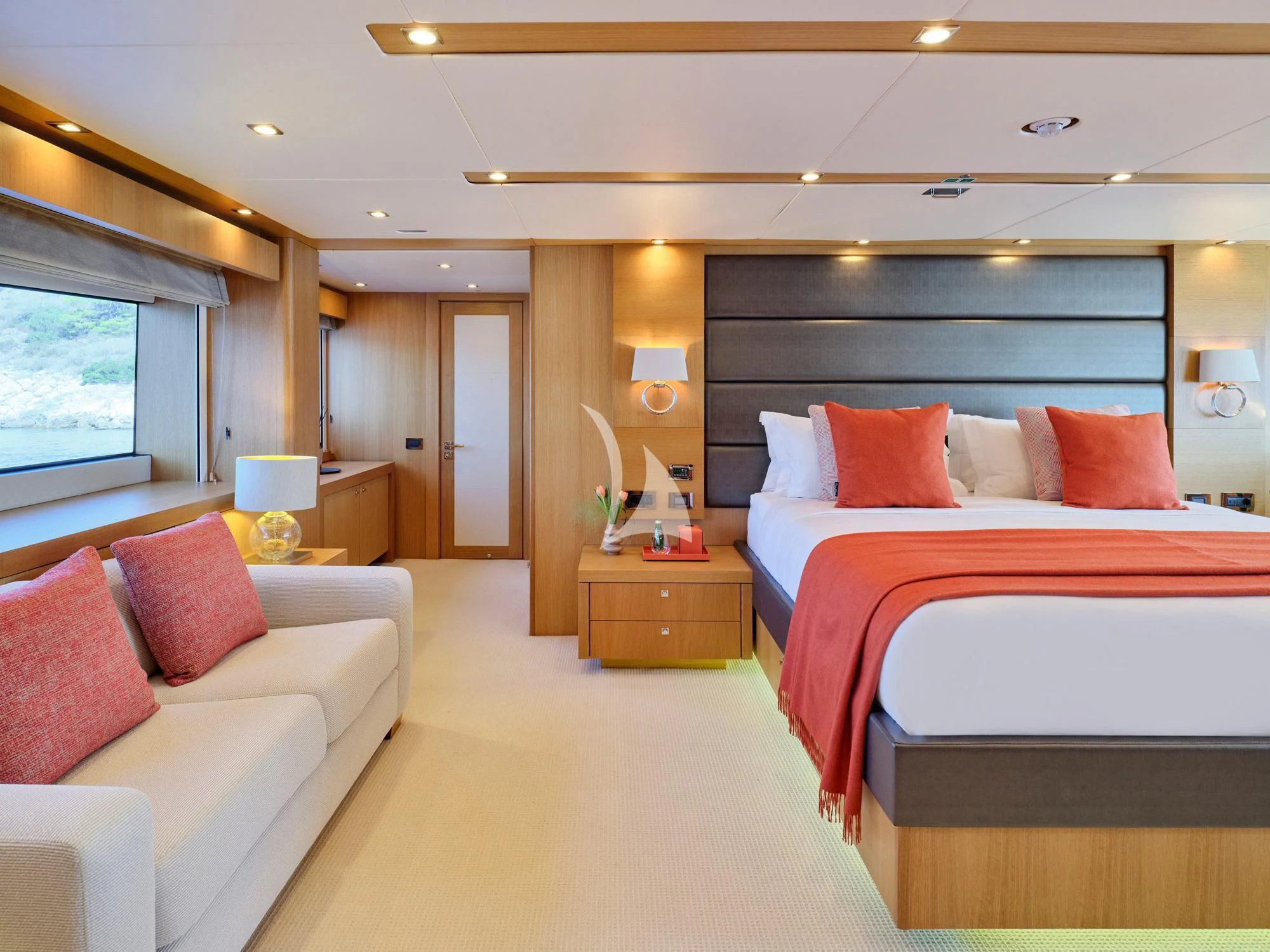 a hotel room with a bed and a couch aboard MAKANI II Yacht for Charter