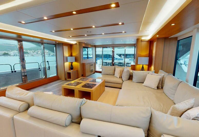 a living room with a large window aboard MAKANI II Yacht for Charter