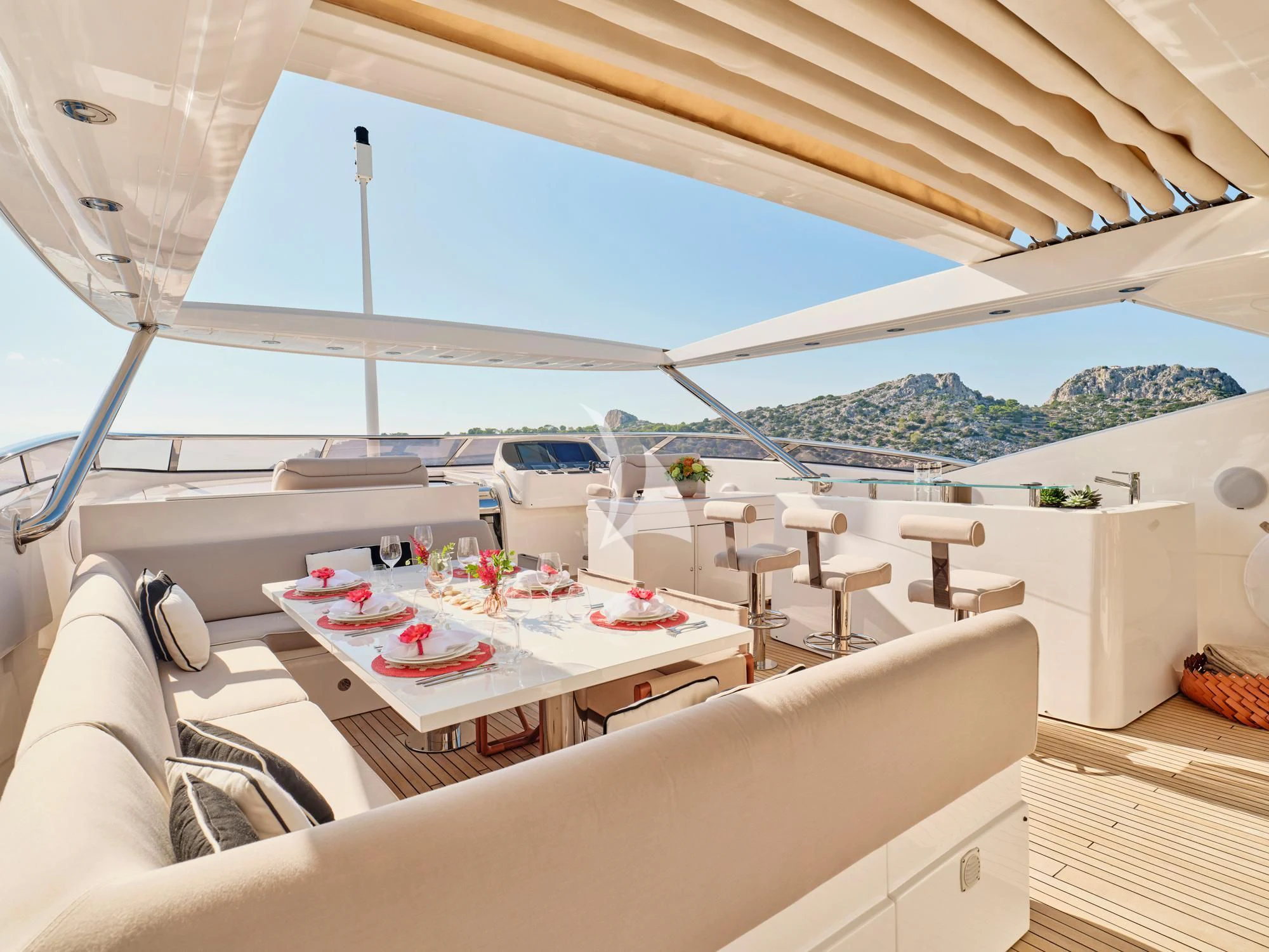 a room with a table and chairs aboard MAKANI II Yacht for Charter