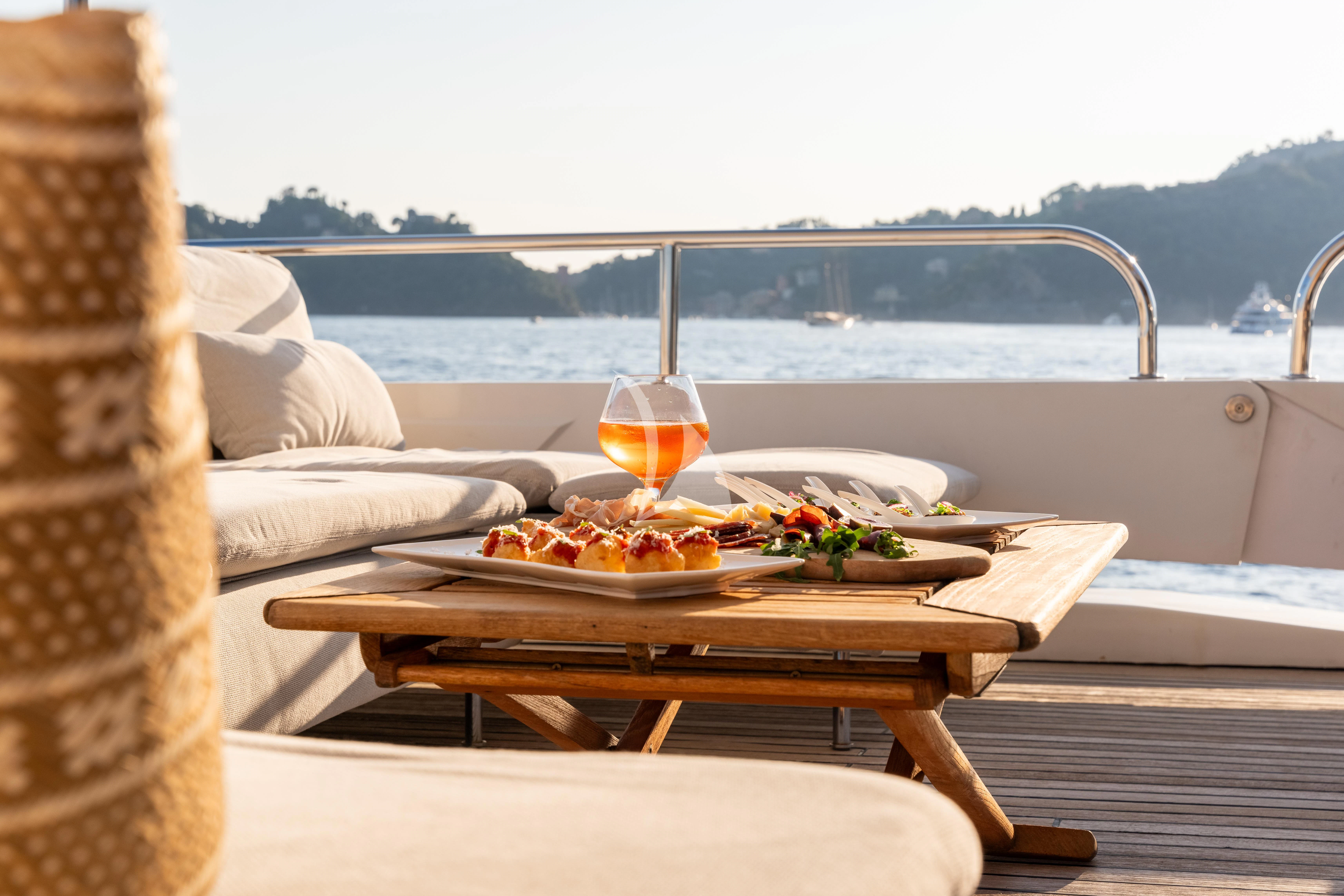 a table with food on it aboard SEA LADY II Yacht for Sale
