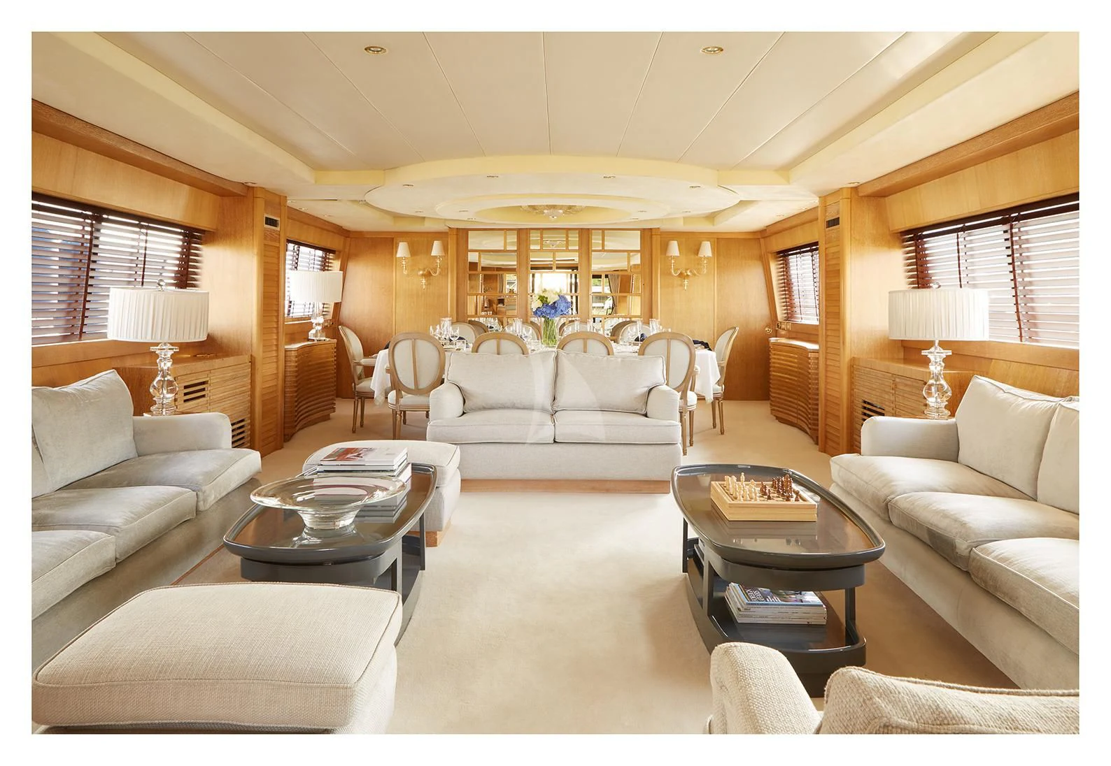 a living room with a large window aboard SEA LADY II Yacht for Sale