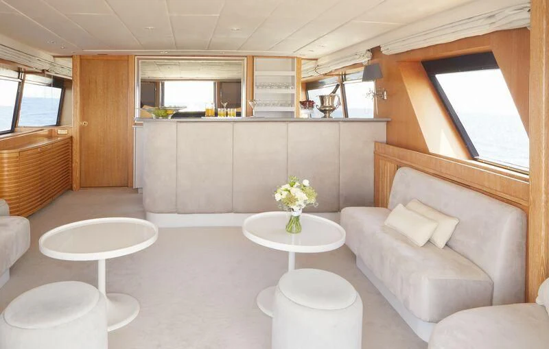 a living room with a couch and a table aboard SEA LADY II Yacht for Sale
