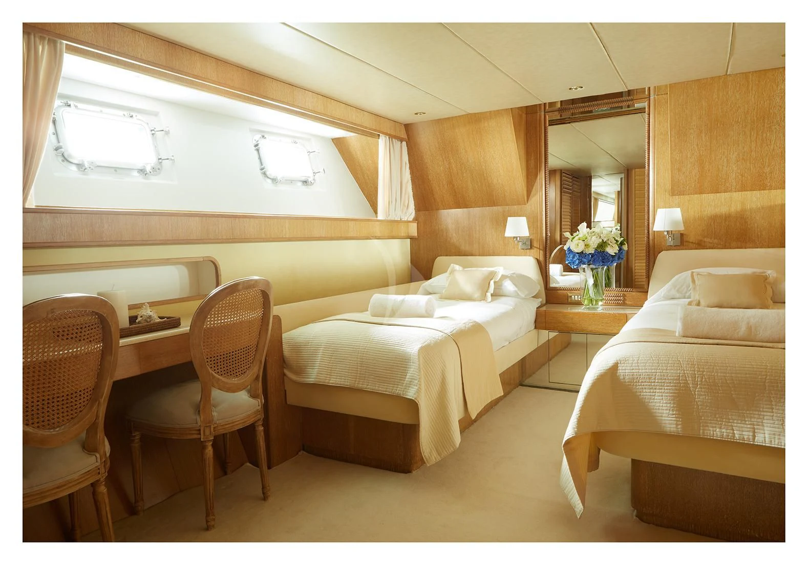 a room with a couple of beds aboard SEA LADY II Yacht for Sale