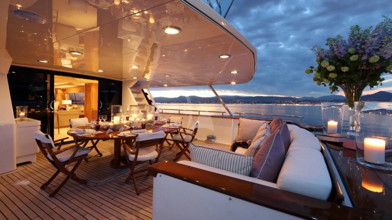 a room with a table and chairs aboard SEA LADY II Yacht for Sale