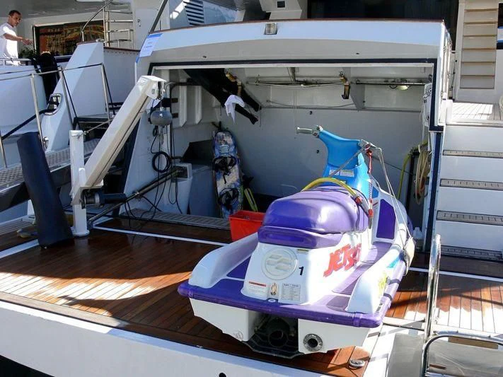 a car in a garage aboard SEA LADY II Yacht for Sale