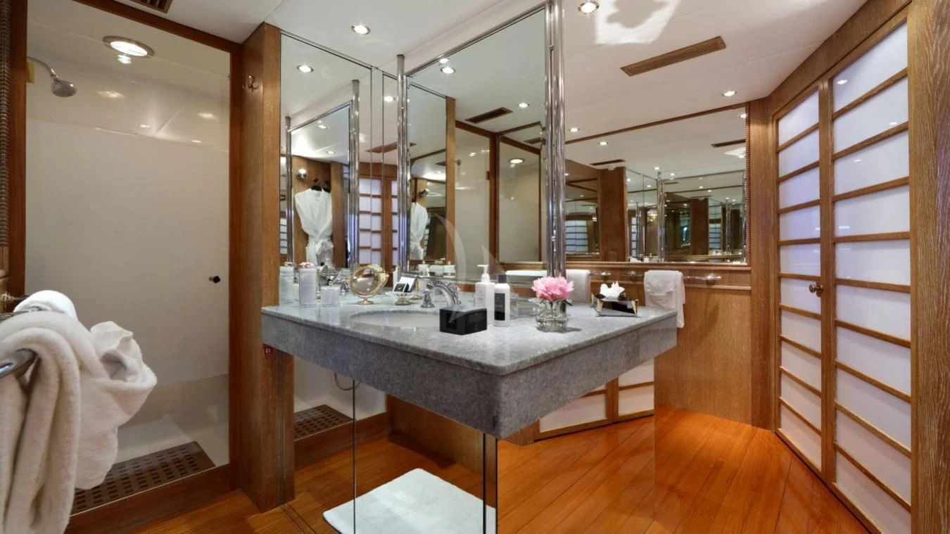 a bathroom with a countertop sink and mirror aboard SEA LADY II Yacht for Sale