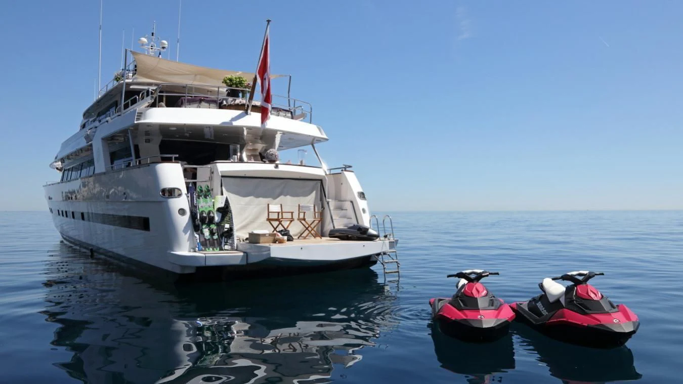 a boat and a small boat in the water aboard SEA LADY II Yacht for Sale