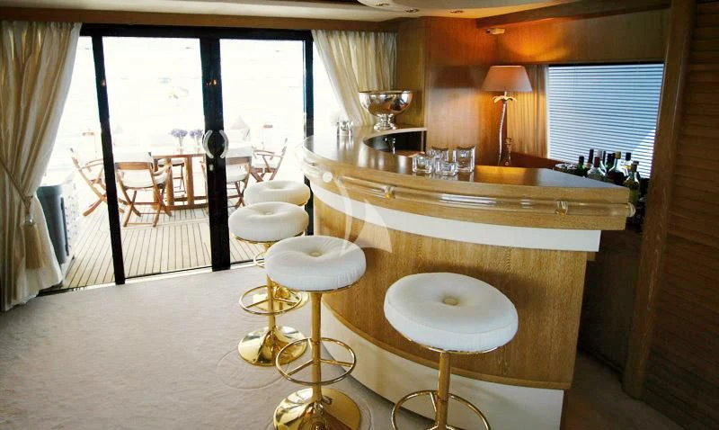 a kitchen with a table and chairs aboard SEA LADY II Yacht for Sale