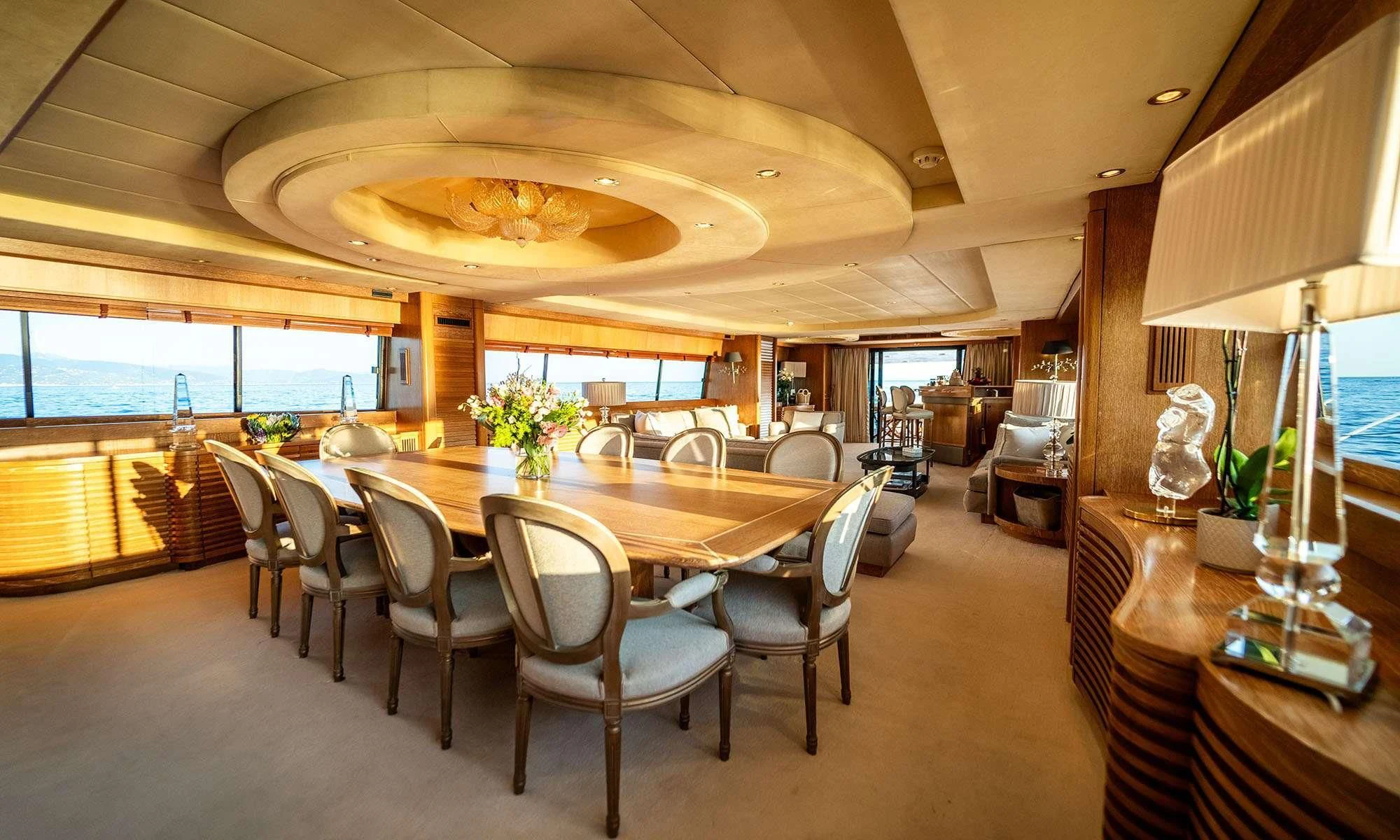 a large dining room with a large table and chairs aboard SEA LADY II Yacht for Sale