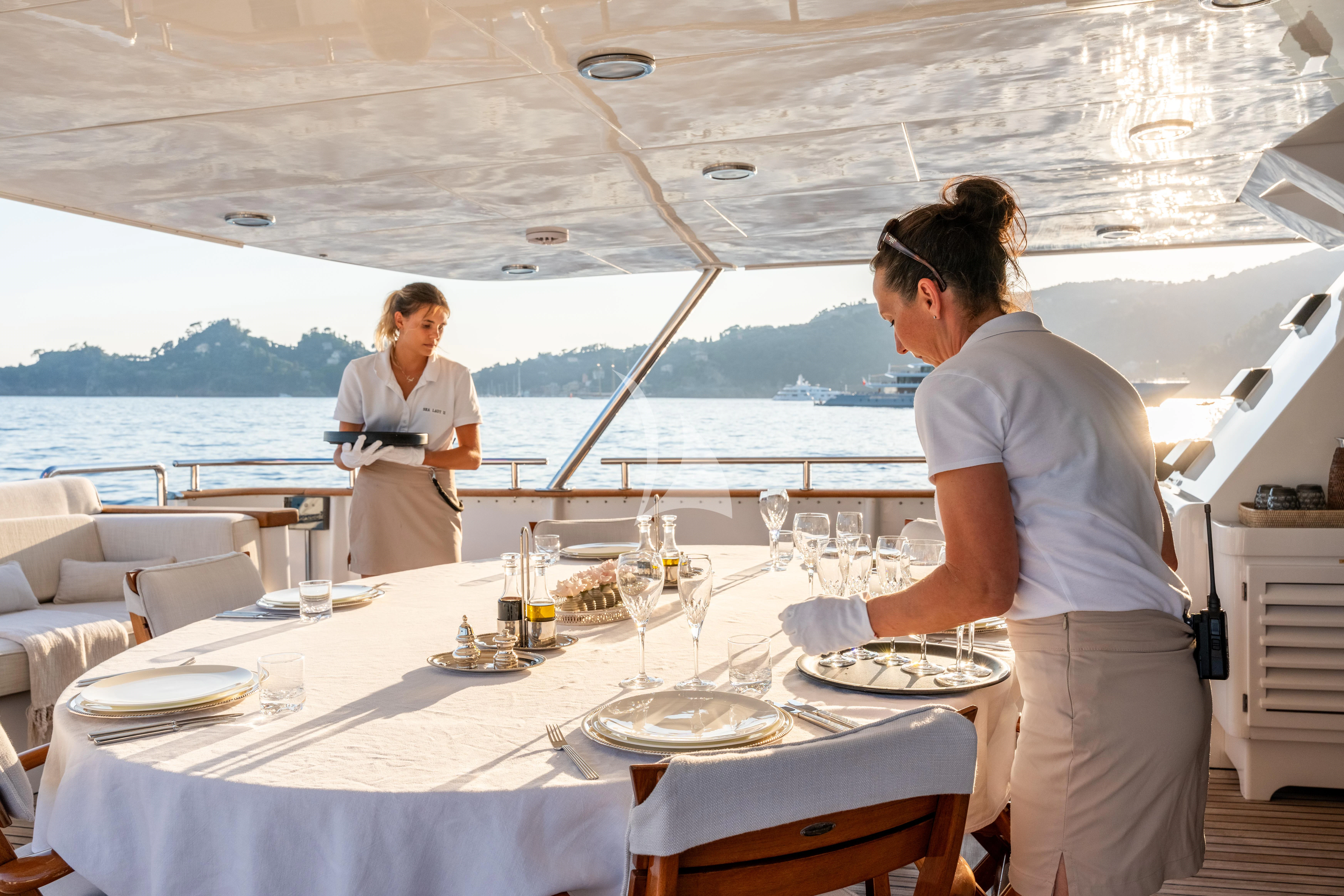 a couple of people at a table aboard SEA LADY II Yacht for Sale