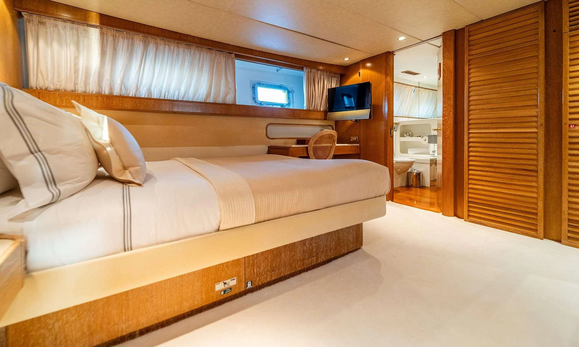 a bed in a room aboard SEA LADY II Yacht for Sale