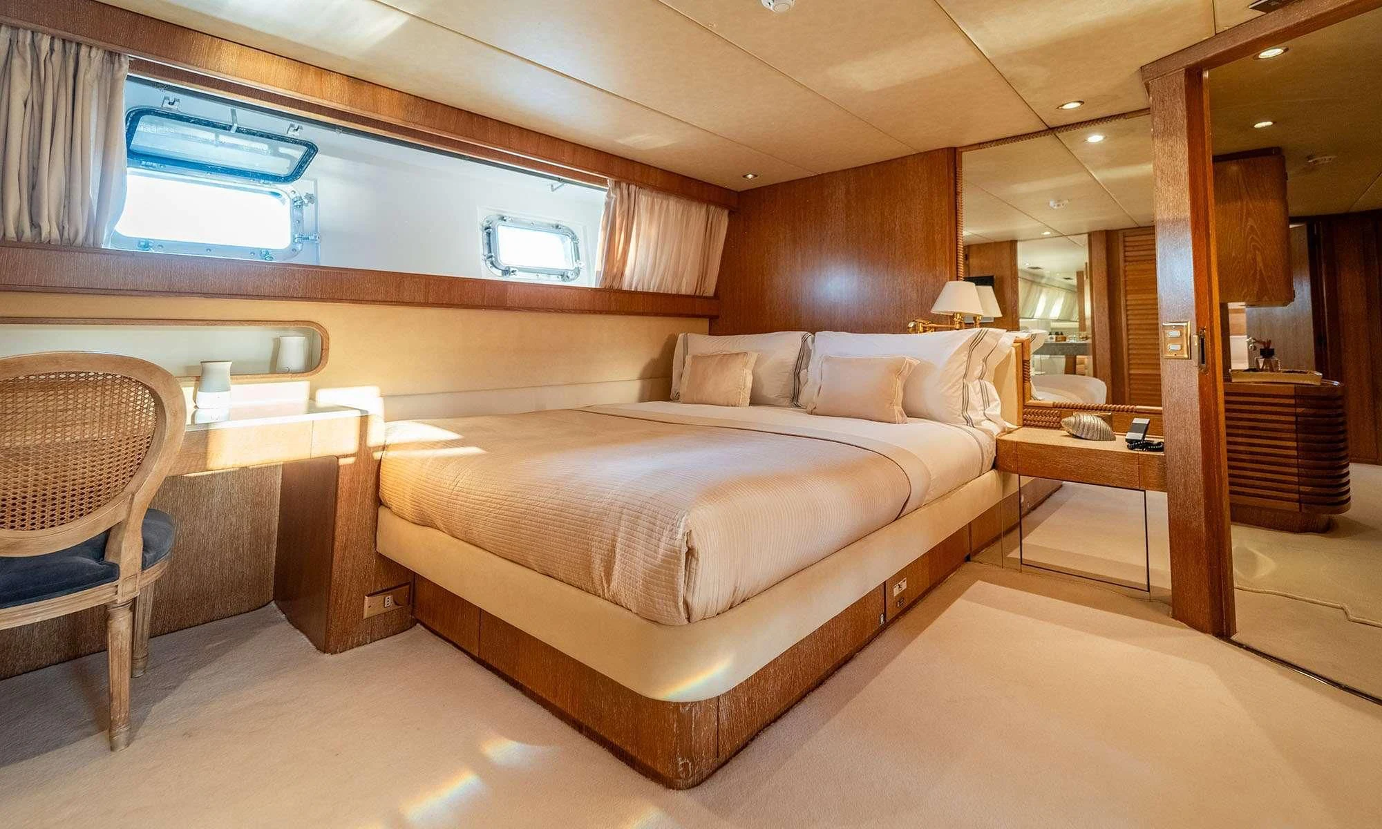 a large bed in a room aboard SEA LADY II Yacht for Sale