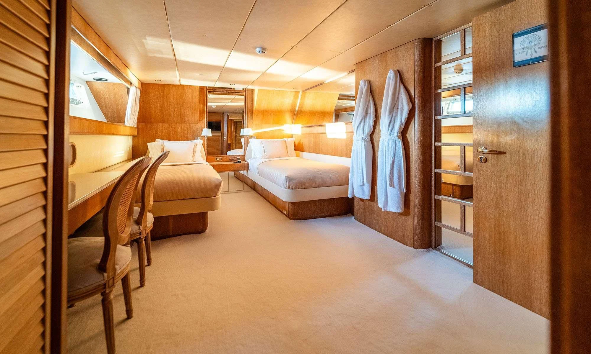 a room with a bed and a couch aboard SEA LADY II Yacht for Sale