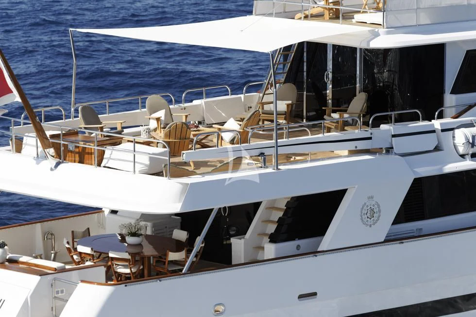 a boat with a table and chairs on the deck aboard SEA LADY II Yacht for Sale