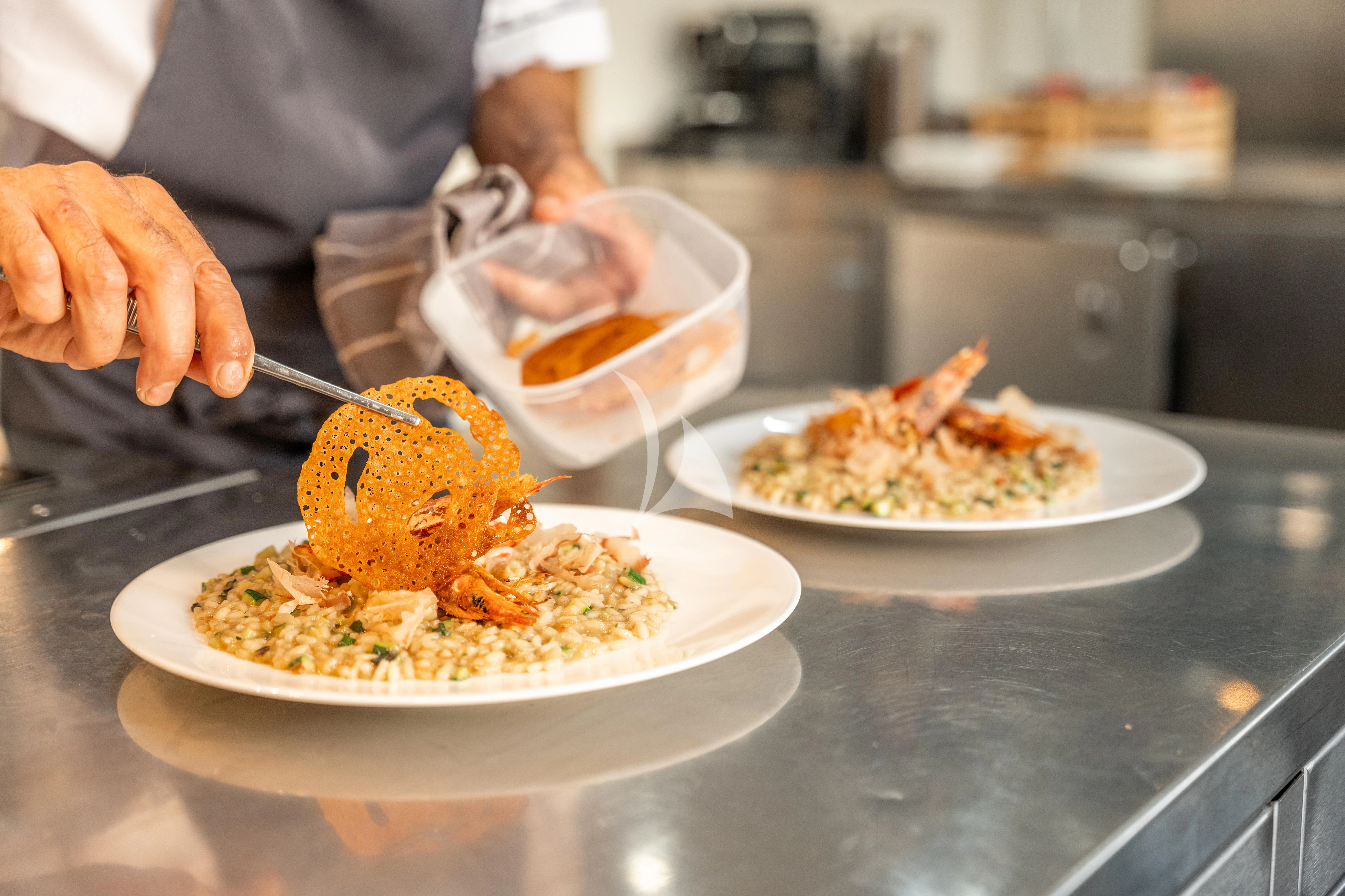 a person eating a plate of food aboard SEA LADY II Yacht for Sale