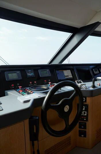 a computer desk with a fan aboard SEA LADY II Yacht for Sale