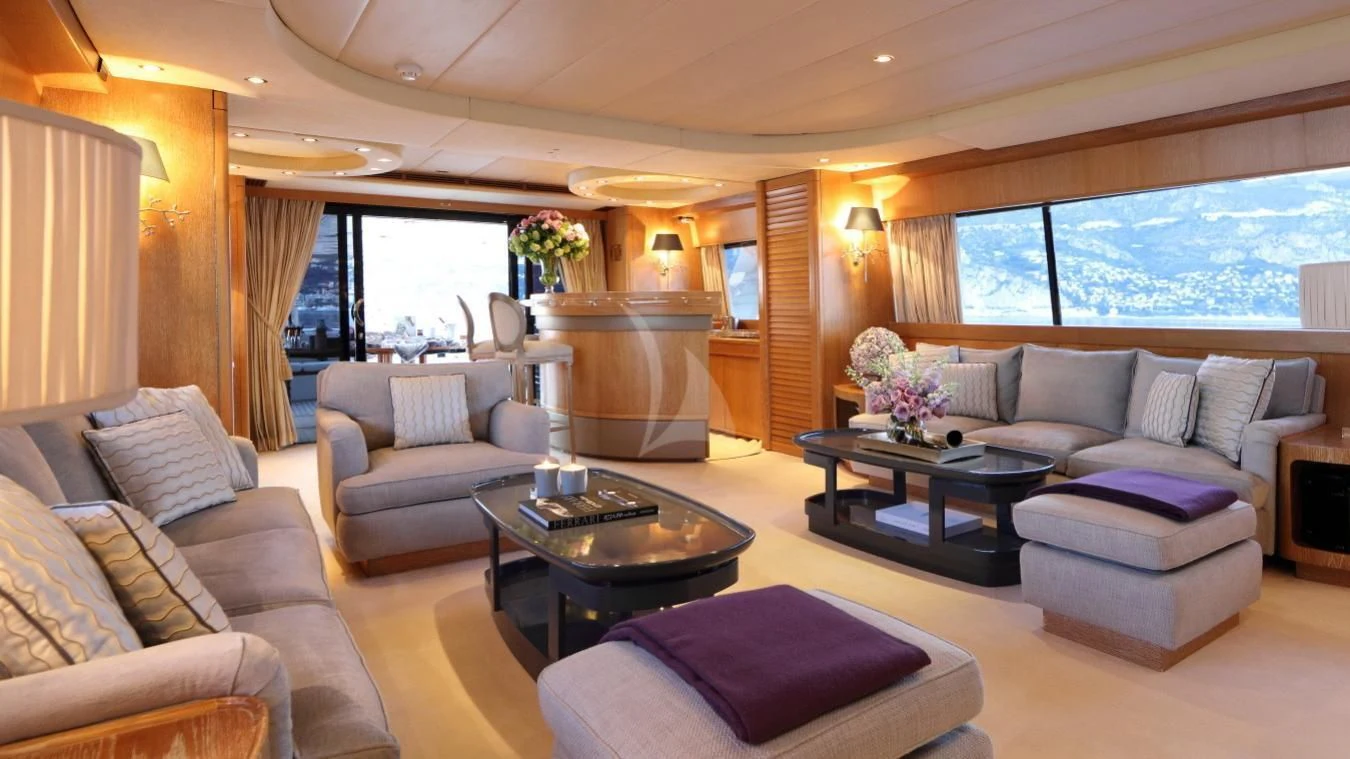 a living room with a fireplace aboard SEA LADY II Yacht for Sale