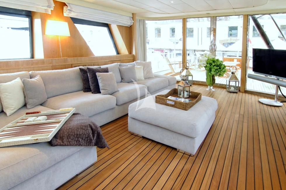 a living room with a couch and a table aboard SEA LADY II Yacht for Sale