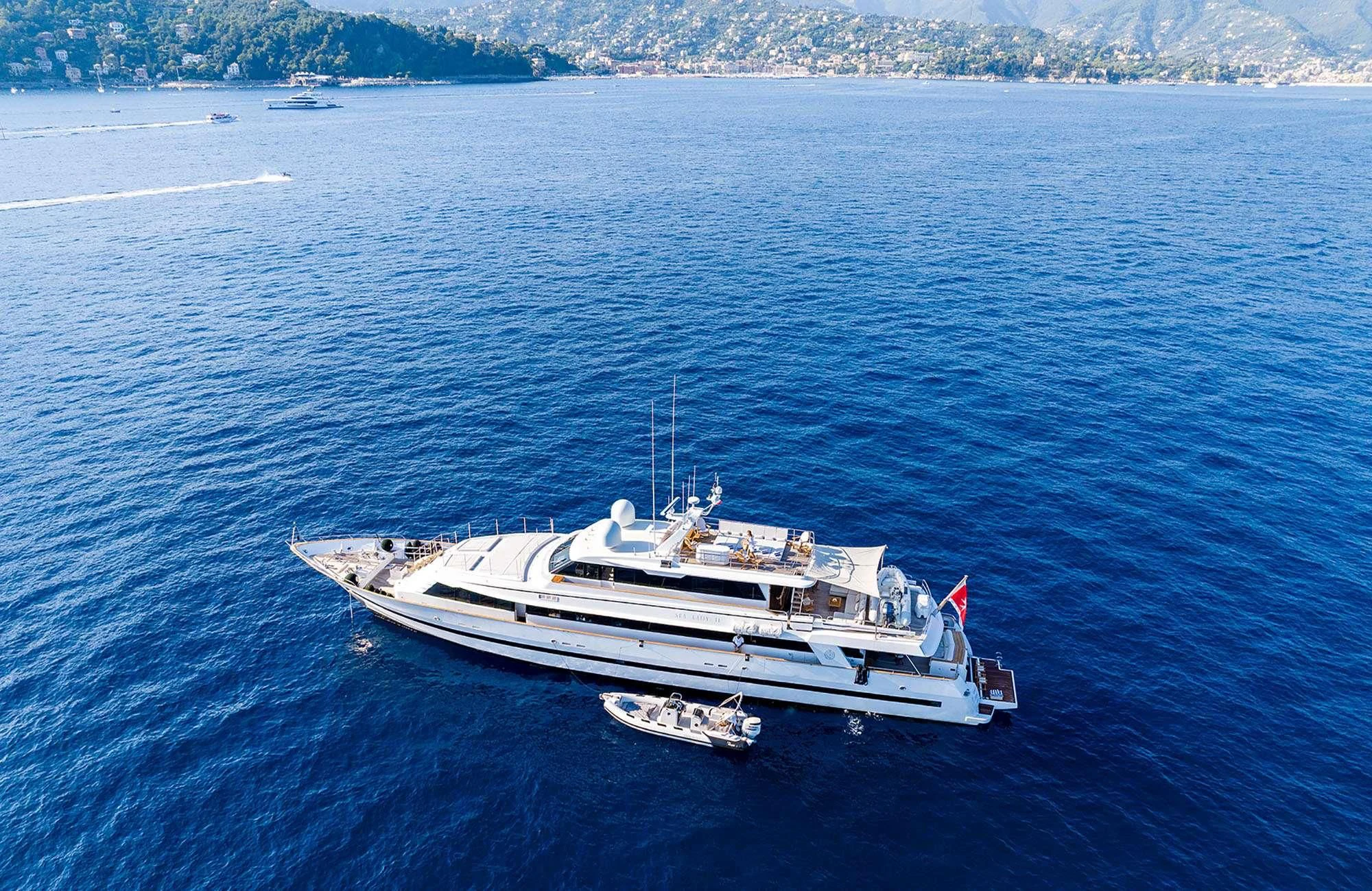 a large ship in the water aboard SEA LADY II Yacht for Sale