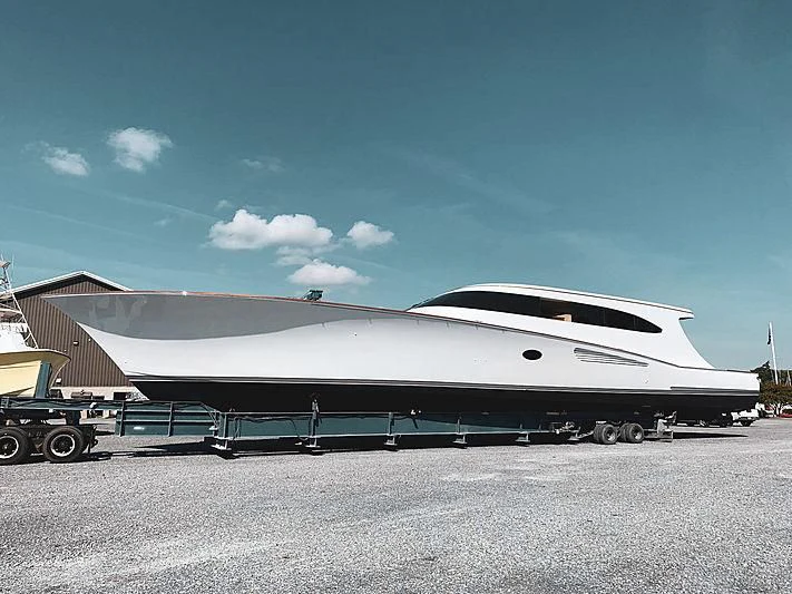 a white building with a black roof aboard 18 REELER Yacht for Sale
