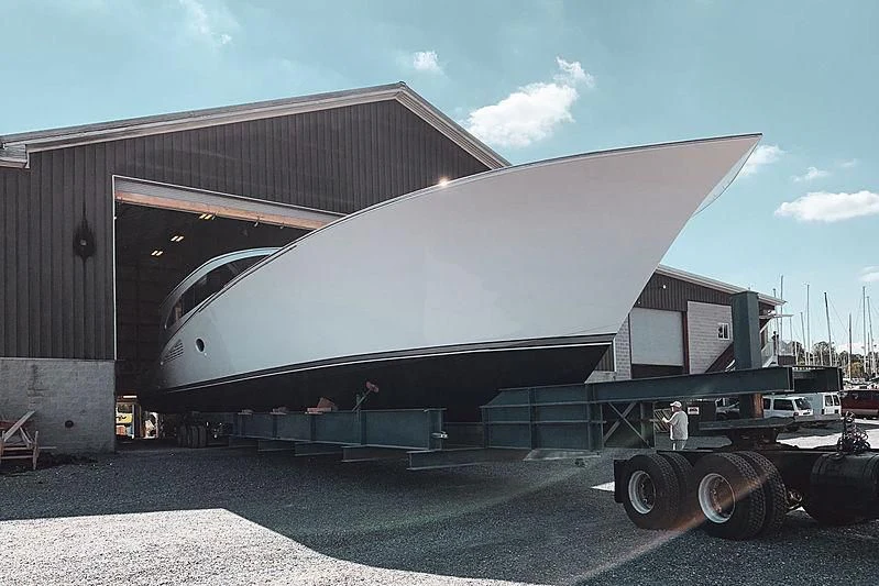a trailer with a large metal structure aboard 18 REELER Yacht for Sale