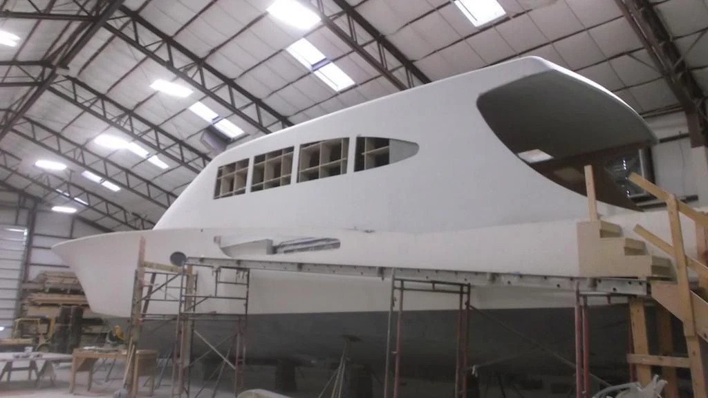 a white helicopter in a building aboard 18 REELER Yacht for Sale