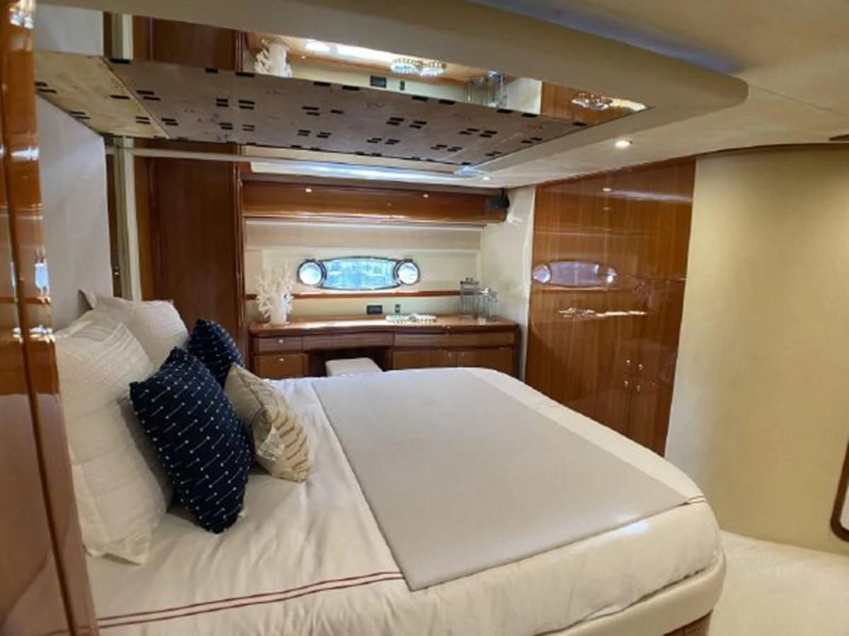 a bed with a white sheet and pillows aboard 2005 760 FERRETTI MOTOR YACHT Yacht for Sale