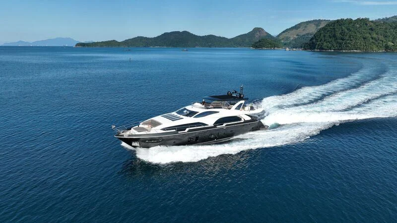 a white yacht on the water aboard OKTO Yacht for Sale