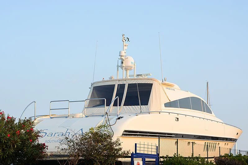 a white boat with a cross on it aboard A4 Yacht for Sale