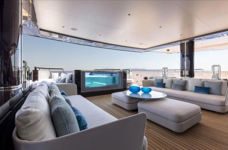 a living room with a large screen aboard POLESTAR Yacht for Sale